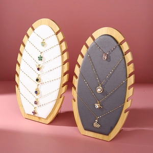 Bamboo necklace display stand with leather padding for jewelry organization and retail