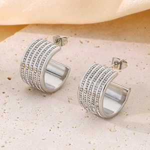 Detailed view of silver titanium steel C-hoop earrings with four rows of sparkling rhinestones
