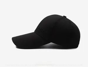 Detail showing side view of black baseball cap with white FIRST letter embroidery