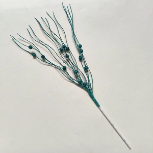 Detailed view of teal and pink glittery artificial decorative branches for Christmas tree