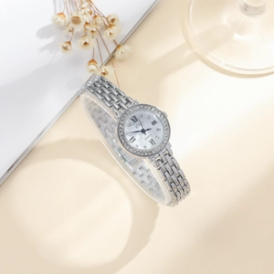 Detail of silver ladies quartz watch with diamond bezel on elegant display