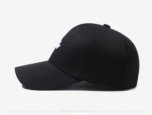 Side view of a black baseball cap featuring 3D white embroidery and a curved brim