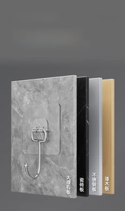 Detail of a strong transparent adhesive hook applied on marble, tile, and metal surfaces