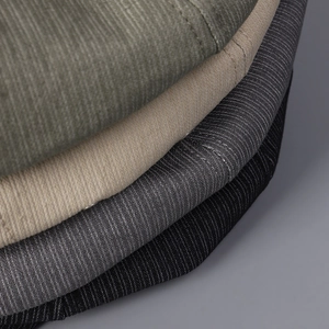 Detailed macro view of retro octagonal hats showing striped fabric texture and colors