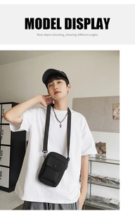 Model display of black nylon crossbody bag with adjustable strap in a casual street style