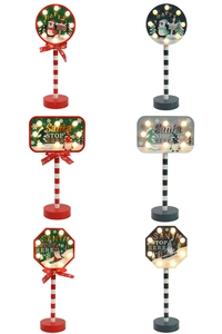 Detailed grid of LED wooden Christmas road signs with Santa Stop Here text