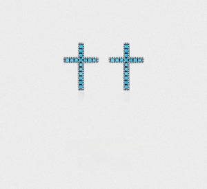 Close-up of S925 sterling silver cross earrings with synthetic turquoise inlay