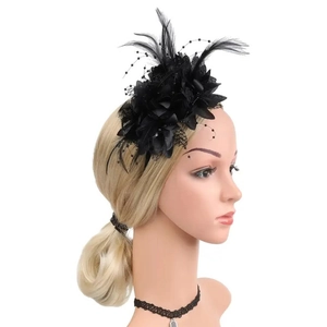 Detail of black feather fascinator with mesh flower and beads on mannequin