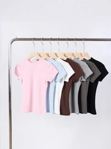 Slim fit modal t-shirts in multiple colors hanging on racks with ribbed texture detail