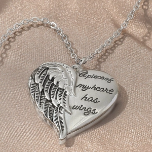 Silver angel wing heart necklace engraved with A piece of my heart has wings text