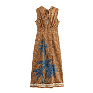 Detail of the back tie-up bow and cutout on this tropical coconut tree print maxi dress