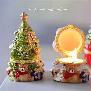 Detail of Christmas tree ceramic jewelry box with gold star and festive bear figurine