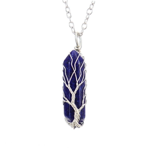 Detail of tree of life wire-wrapped dark blue hexagonal crystal pillar necklace pendant