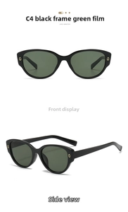 Vue détaillée de lunettes de soleil œil de chat, monture noire et verres verts