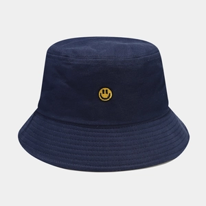 Dark blue canvas bucket hat with yellow smile embroidery for outdoor sun protection
