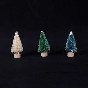 Miniature sisal Christmas trees in beige green and teal with snowy texture and wood base