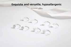 Detail view of 925 sterling silver earrings featuring daisy, clover, and butterfly designs
