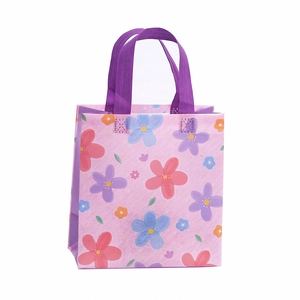 Vliestasche mit Blumendruck, lila Tragegriffen und bunten Blumenmustern für Einkäufe