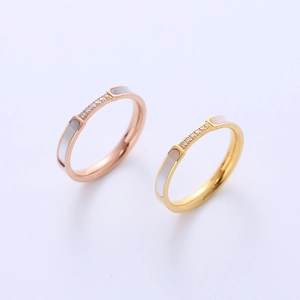 Elegant rose gold and gold titanium rings with shell inlay and cubic zirconia