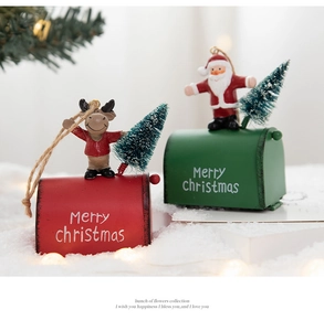 Festive Christmas mailbox hanging ornaments with Santa and reindeer motifs in snow