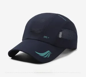 Detail view of navy blue quick-dry baseball cap with breathable mesh and side logo