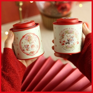 Pair of mini tinplate tea canisters with festive bunny wedding illustration for gift sets
