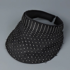 Close-up of black mesh visor featuring sparkling rhinestones and breathable fabric detail