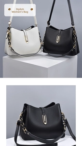 Detail showing pebbled leather texture and gold hardware on black and white handbags