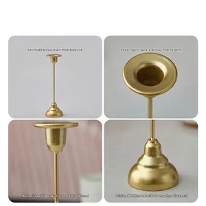 Golden iron candlestick holder with slender stem and stable base for romantic dinner decor