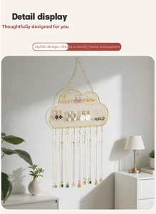 Detail view of cloud-shaped gold iron jewelry organizer with mesh and ten hooks