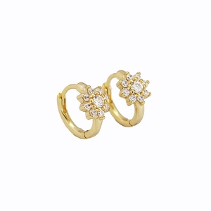 Elegant gold flower hoop earrings with sparkling zircon crystals on white background