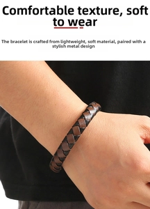 Close-up of hand-woven leather bracelet featuring brown and black braided textures