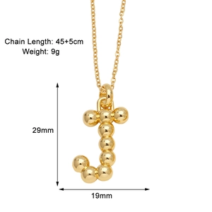 Detail of golden letter J pendant necklace showing dimensions and ball chain texture
