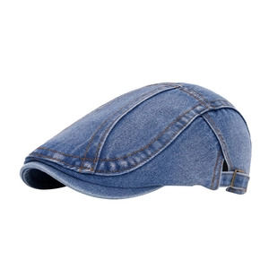 Vintage blue denim beret hat with orange stitching and adjustable brass buckle closure