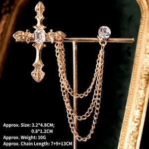Detail of vintage gold cross collar chain with clear crystals and elegant fringe