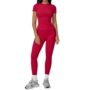 Slim fit dark red yoga set featuring crew neck t-shirt and high waist leggings for women