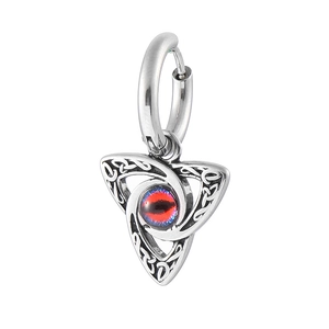 Detail of 316L stainless steel moon evil eye earring with Celtic knot patterns