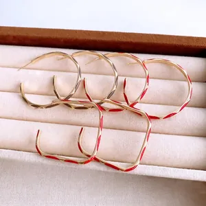 Modern enamel geometric earrings set with red and grey finish in a jewelry box