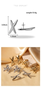 Detail view of X-shaped geometric earrings in gold and silver finish with size specs