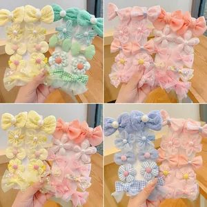 Cute floral and bow hair clips set for girls in yellow, green, pink and purple tones