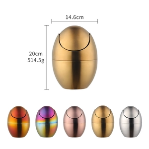 Mini stainless steel egg-shaped desktop trash bin with swing lid in five metallic colors