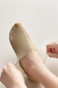 Close-up of beige thin ice silk invisible socks with non-slip silicone heel grip