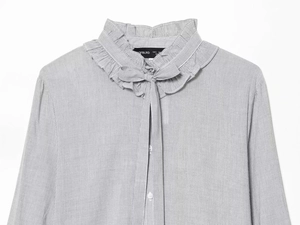 Detail of ruffled stand collar and tie-bow on grey striped women shirt with buttons