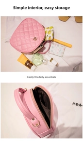 Detailed interior of a pink quilted bag with storage for perfumes and cosmetics