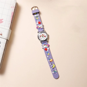 Detail of purple silicone kids watch featuring 3D unicorn rainbow elements and clear dial