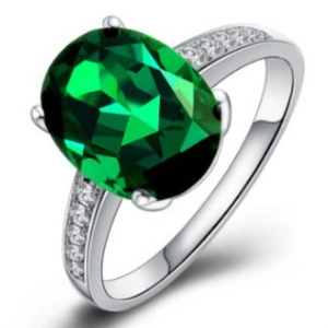 Elegant silver ring with oval green cubic zirconia stone and side diamond accents