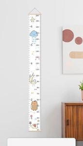 Close-up of canvas height chart with wooden frame measuring up to 200cm for kids room