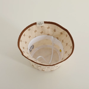 Detail of baby bear bucket hat with soft lining and adjustable white windproof chin strap