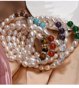 Macro detail of natural freshwater pearl bracelets with colorful agate beads and crystal spacers