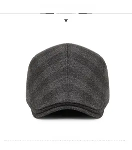 Front view of grey checkered flat cap for men with warm wool texture and detail